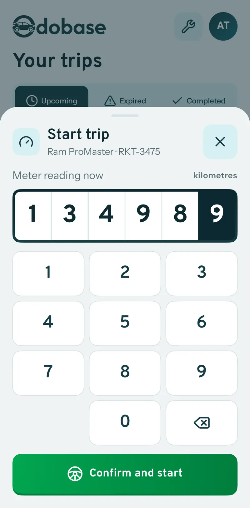 Start trip sheet asking for the current meter reading in kilometres, with a six-digit odometer display, a number pad and a Confirm and start button